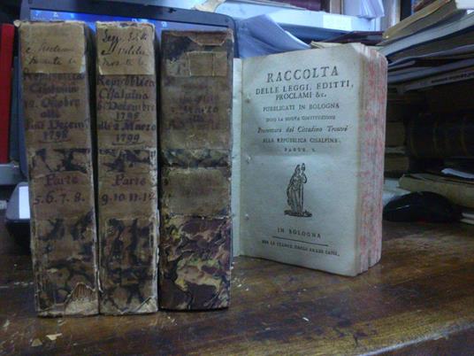 Raccolta delle leggi, editti, proclami & c. pubblicati in Bologna dopo la nuova costituzione. Presentata dal cittadino Trouvé alla repubblica Cisalpina. parti 1-17. in quattro volumi - copertina