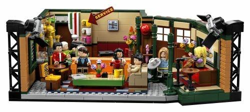 Lego rose su un tavolo con un divano nero sullo sfondo ai generativa