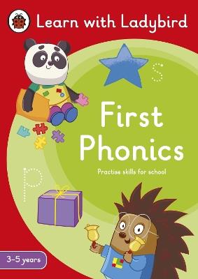 First Phonics: A Learn with Ladybird Activity Book (3-5 years): Ideal for home learning (EYFS) - Ladybird - cover