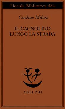 Il cagnolino sul bordo della strada